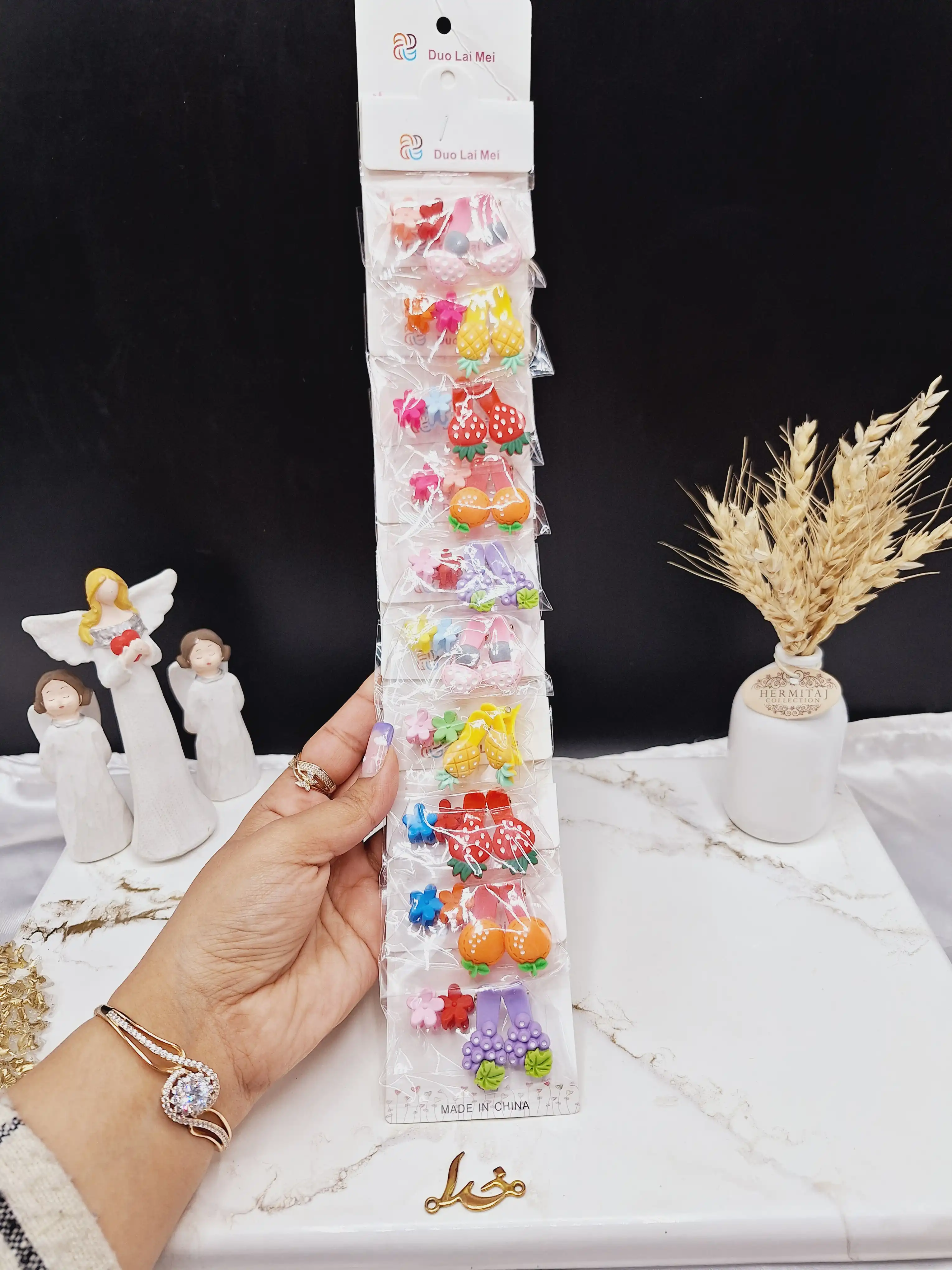 پک 10 عددی گیره مو دخترانه طرح گل و میوه